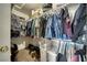 Walk-in closet features built-in shelving, hanging rods, and ample storage space at 3581 Margarita Ave, Pahrump, NV 89048