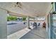 A comfortable covered patio with outdoor seating and an open backyard with desert landscaping at 3581 Margarita Ave, Pahrump, NV 89048