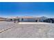 Charming single-story home features a tile roof, attached garage, desert landscaping and a long, paved driveway at 3581 Margarita Ave, Pahrump, NV 89048
