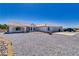 Attractive single-story home featuring a tile roof, desert landscaping and a circular paved driveway at 3581 Margarita Ave, Pahrump, NV 89048