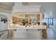 Eat-in kitchen with raised bar and a view of stainless steel appliances and natural wood cabinetry at 3581 Margarita Ave, Pahrump, NV 89048