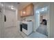 Convenient laundry area featuring modern washer and dryer with tile flooring and storage at 3581 Margarita Ave, Pahrump, NV 89048