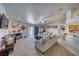 The bright living room offers carpeted floors, an entertainment center, comfortable seating, and backyard access at 3581 Margarita Ave, Pahrump, NV 89048