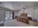 Comfortable main bedroom with large windows, ceiling fan, and sliding glass door to private patio at 3581 Margarita Ave, Pahrump, NV 89048