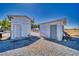 This outdoor space is improved by two storage sheds. The sheds are painted white, each with a single door at 3581 Margarita Ave, Pahrump, NV 89048