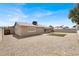 Expansive backyard with gravel, patio, block wall, offering a low maintenance space at 4270 Wendy Ln, Las Vegas, NV 89115