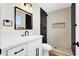 Modern bathroom with sleek black fixtures, white vanity, and stylish tiled shower at 4270 Wendy Ln, Las Vegas, NV 89115