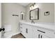 Bathroom with white cabinets, quartz countertops, a toilet, and laminate wood flooring at 4270 Wendy Ln, Las Vegas, NV 89115