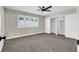 Bedroom featuring carpet, closet with sliding doors, ceiling fan, and window with shutters at 4270 Wendy Ln, Las Vegas, NV 89115