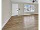 View of living space featuring hardwood flooring, a ceiling fan, and a window to the right of the front door at 4270 Wendy Ln, Las Vegas, NV 89115
