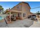 Wide backyard view of a house, pool, patio with a dining set, and boat on trailer at 4990 Spring Oak St, Las Vegas, NV 89120