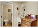 Powder room features granite countertops, ample storage, and tile flooring at 4990 Spring Oak St, Las Vegas, NV 89120