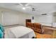 Bedroom featuring a ceiling fan, a large whiteboard, and ample space for a bed and seating at 4990 Spring Oak St, Las Vegas, NV 89120