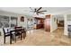 Open dining area with views of the pool and kitchen, creating an inviting space for entertaining at 4990 Spring Oak St, Las Vegas, NV 89120