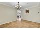 This dining area has tile flooring, chandelier lighting and a view of the house interior at 4990 Spring Oak St, Las Vegas, NV 89120