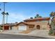 Inviting two-story home with a wide driveway, showcasing ample parking and a welcoming facade at 4990 Spring Oak St, Las Vegas, NV 89120