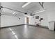 Spacious and clean garage with high ceilings, ceiling fan, utility sink and ample lighting at 4990 Spring Oak St, Las Vegas, NV 89120