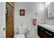 Well-lit half bathroom featuring a modern vanity, toilet with a bidet, and tiled shower at 4990 Spring Oak St, Las Vegas, NV 89120