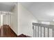Second floor hallway with hardwood floors and access to bedrooms and bathrooms at 4990 Spring Oak St, Las Vegas, NV 89120