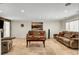 Spacious living room featuring neutral walls, tile flooring, and comfortable seating arrangement at 4990 Spring Oak St, Las Vegas, NV 89120