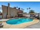 Inviting backyard pool with diving board, hot tub and covered patio, perfect for outdoor entertaining at 4990 Spring Oak St, Las Vegas, NV 89120