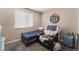 Bedroom with carpet, twin bed, and a dart board on the wall at 5804 Apple Valley Ln, Las Vegas, NV 89108