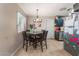 Dining area featuring tile floors, a light fixture, and a dining table at 5804 Apple Valley Ln, Las Vegas, NV 89108