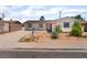 Charming single-story home with desert landscaping, a long driveway, and a mailbox near the front sidewalk at 5804 Apple Valley Ln, Las Vegas, NV 89108