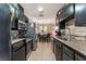 Cozy kitchen with tile floors and stainless steel appliances at 5804 Apple Valley Ln, Las Vegas, NV 89108