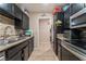 Kitchen with tile floors and a view of the dining area at 5804 Apple Valley Ln, Las Vegas, NV 89108