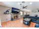 Bright living room with fireplace, ceiling fan, and an open-concept design at 5804 Apple Valley Ln, Las Vegas, NV 89108