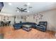 Open-concept living room and dining area with hardwood flooring and a ceiling fan at 5804 Apple Valley Ln, Las Vegas, NV 89108