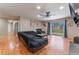 Bright living room features wood floors, slider to the backyard and a modern ceiling fan at 5804 Apple Valley Ln, Las Vegas, NV 89108