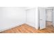 A bedroom featuring a closet with sliding doors and wood-look flooring at 5822 E Carey Ave, Las Vegas, NV 89156
