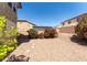 The home has a low maintenance backyard that is gravel and includes nice shrubbery at 5912 Kit Cove Ct, Las Vegas, NV 89131