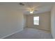 Bedroom featuring neutral walls, plush carpet and a ceiling fan at 5912 Kit Cove Ct, Las Vegas, NV 89131