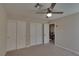 A cozy bedroom with ample closet space, carpet and a ceiling fan at 5912 Kit Cove Ct, Las Vegas, NV 89131