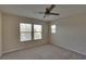 Bright bedroom features natural light, a ceiling fan and neutral walls at 5912 Kit Cove Ct, Las Vegas, NV 89131