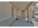 Spacious and covered front porch featuring decorative security screen door with lots of natural light at 5912 Kit Cove Ct, Las Vegas, NV 89131