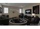 Modern living area, staged, featuring fan-themed decor, contemporary seating, and entertainment space at 5912 Kit Cove Ct, Las Vegas, NV 89131