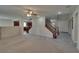 Open-concept floor plan featuring tile entry, fireplace, and wood staircase at 5912 Kit Cove Ct, Las Vegas, NV 89131