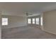 Large living room with natural light and plush carpeting at 5912 Kit Cove Ct, Las Vegas, NV 89131