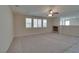 Bright living room with large windows and a cozy fireplace at 5912 Kit Cove Ct, Las Vegas, NV 89131