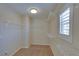 Walk-in closet featuring built in shelving and natural light at 5912 Kit Cove Ct, Las Vegas, NV 89131