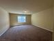 Spacious bedroom with carpet, window and light fixture at 6093 Crown Palms Ave, Las Vegas, NV 89139