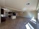 Expansive living area featuring a large kitchen with an island, stainless steel appliances, and ample space at 6093 Crown Palms Ave, Las Vegas, NV 89139