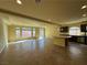Open-concept living space with a large island, stainless steel appliances, and ample natural light at 6093 Crown Palms Ave, Las Vegas, NV 89139
