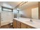 Bright bathroom with double sink vanity, large mirror, and combined shower and tub at 6329 Orange Hue St, North Las Vegas, NV 89031
