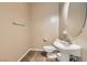 Neat half bathroom with a pedestal sink, tiled floors, and neutral color scheme at 6329 Orange Hue St, North Las Vegas, NV 89031