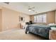 Bedroom with a ceiling fan, carpet, and a window to provide natural lighting at 6329 Orange Hue St, North Las Vegas, NV 89031
